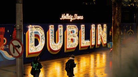 View from the Top Deck of the bus while on O'connell street. You can see a sign of Dublin light up for the festive period.