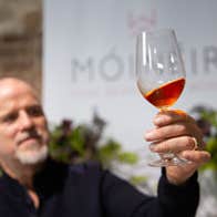 A man looking at a wine at Wicklow Way Wines