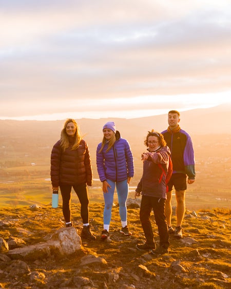 Group of walkers and guide at sunset, Hilltoptrek, Dublin