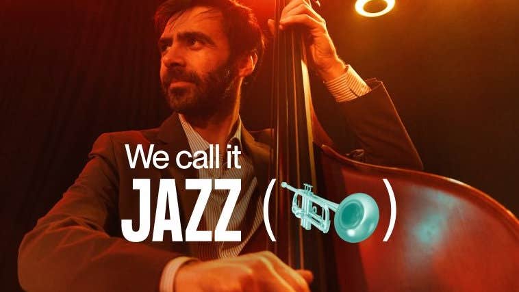 A man in jacket and shirt is playing a double bass, looking way to his right with spotlights behind.