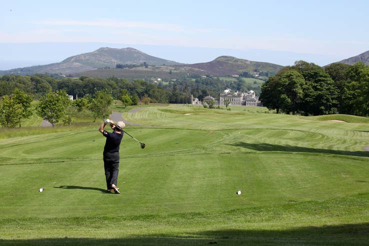 Golfer after swinging his club at Powerscourt Golf Club in Wicklow.