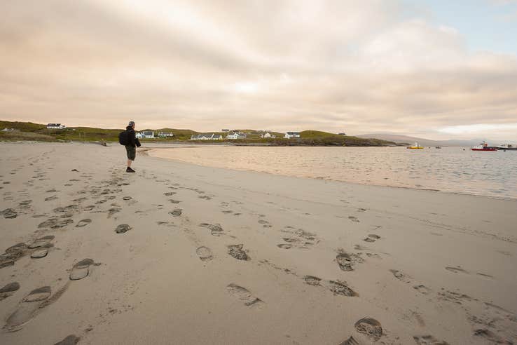A man standing on the beach on Clare Island in County Mayo.
