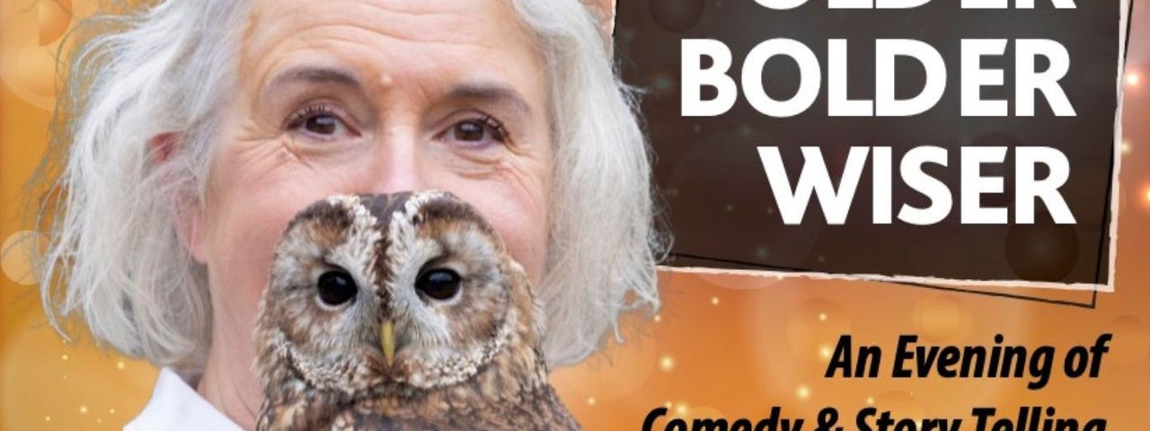 A woman with white hair and shirt, her face partially obscured by a brown owl.