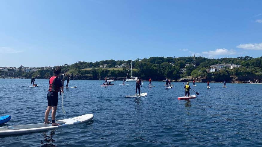 People SUP-ing in Dunmore East in County Waterford.
