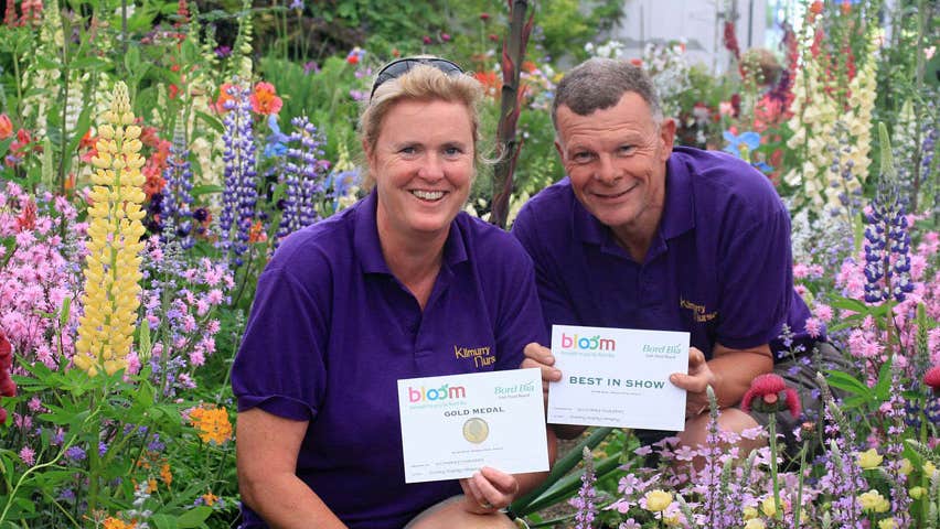 The owners holding the award they won in Bloom Garden Festival