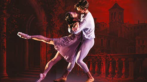 Romeo & Juliet ballet dancers embracing romantically