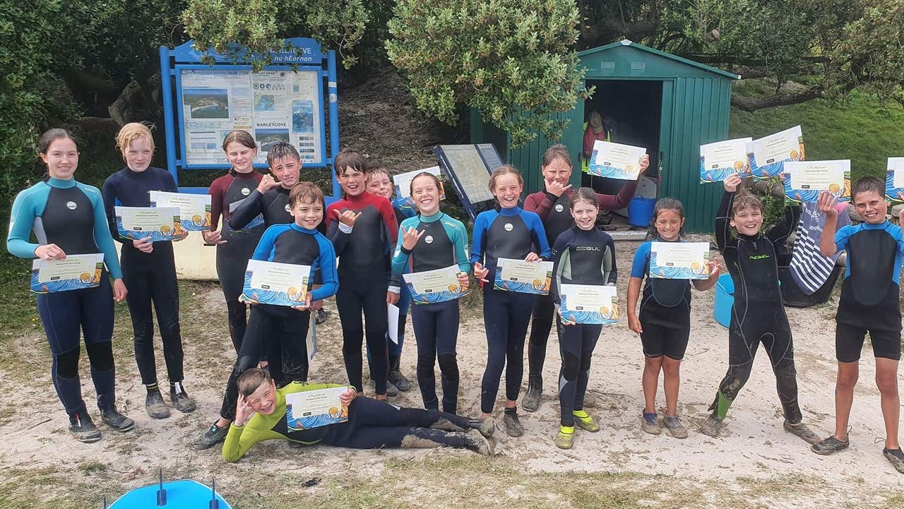 Group at Barleycove Surf Camp with their certificates of completion
