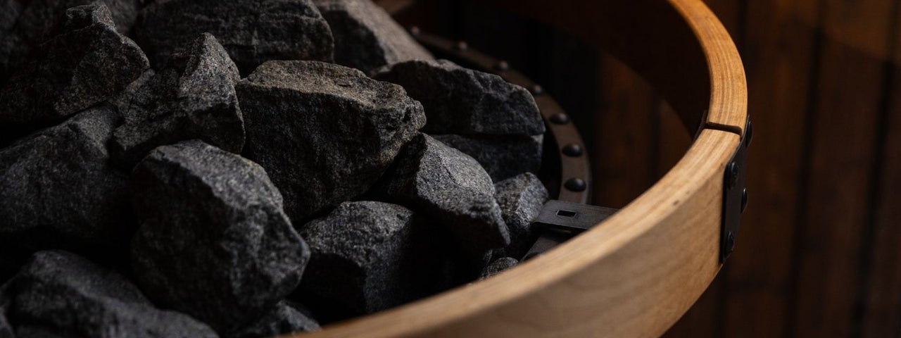 Close up of sauna stones on a sauna stove