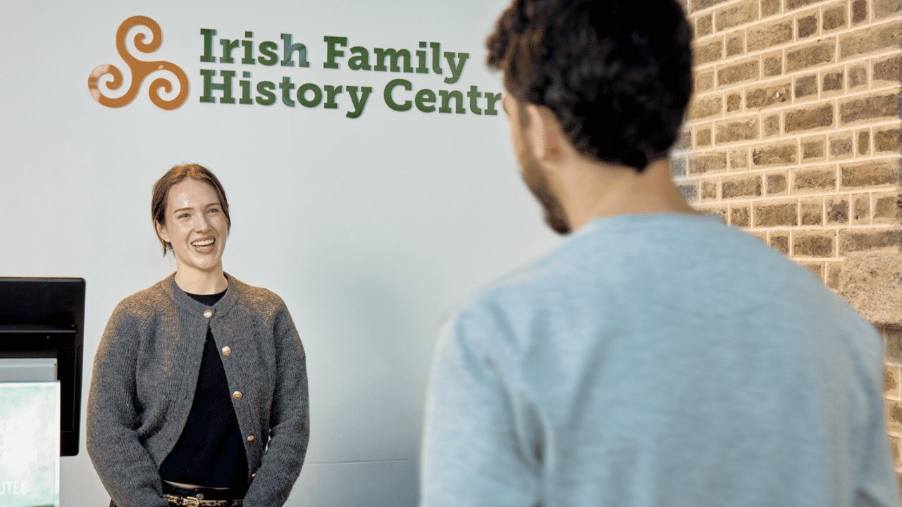 A visitor arrives for a genealogy consultation at the Irish Family History Centre, located at EPIC The Irish Emigration Museum in Dublin's Docklands. Expert guidance helps visitors explore their Irish ancestry.