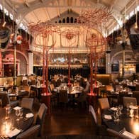 The interior of FIRE Steakhouse & Bar's main restaurant with the dining area all set