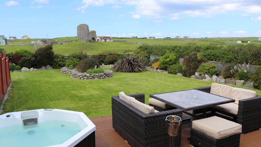 Patio area with hot tub