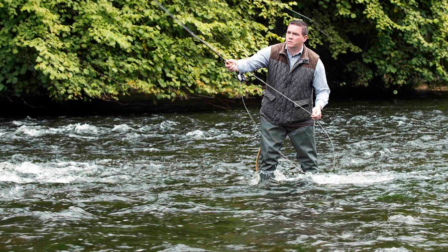 A man angling on one of Mount Juliet Estate's rivers