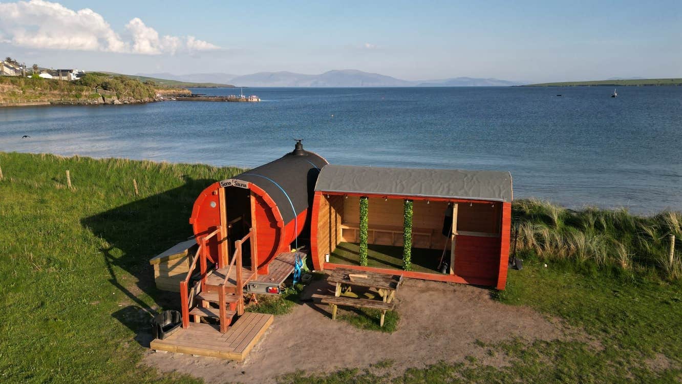 Sona Sauna at Ventry Beach with Ventry village and the sea in the background