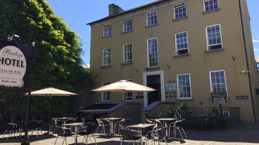 exterior of hotel with outdoor seating