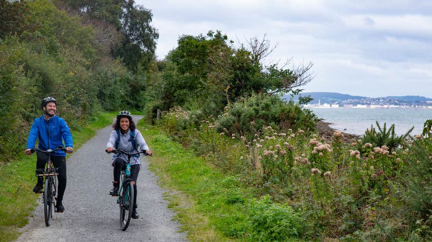 A couple cycling the Carlingford Greenway in Louth