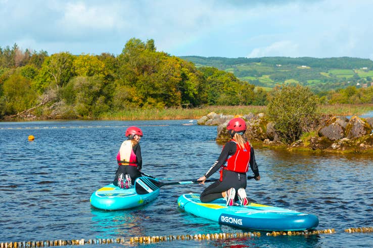People paddle boarding at UL Sports Adventure Centre in County Clare