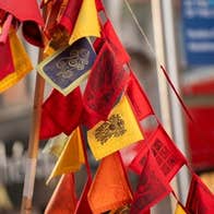 Brigid's Day Imbolg Celebration at Butler Gallery - a bunch of small flags in red, orange and yellow
