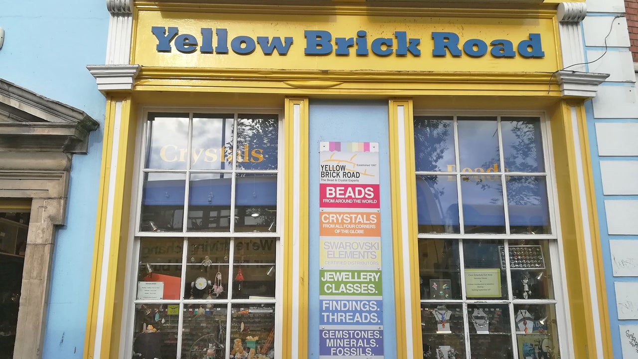 Yellow Brick Road shop exterior with yellow window frames
