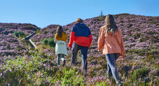 Three people walking the Ridge of Capard in Slieve Bloom in County Laois