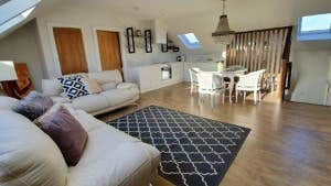 Sitting room with cream couches