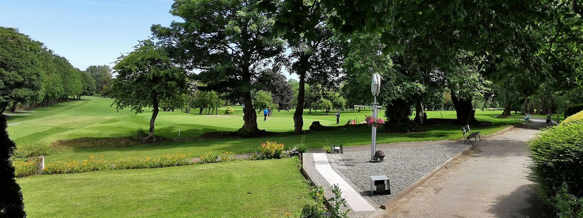 A view of the 18th green and the 1st tee box with fairways in the background