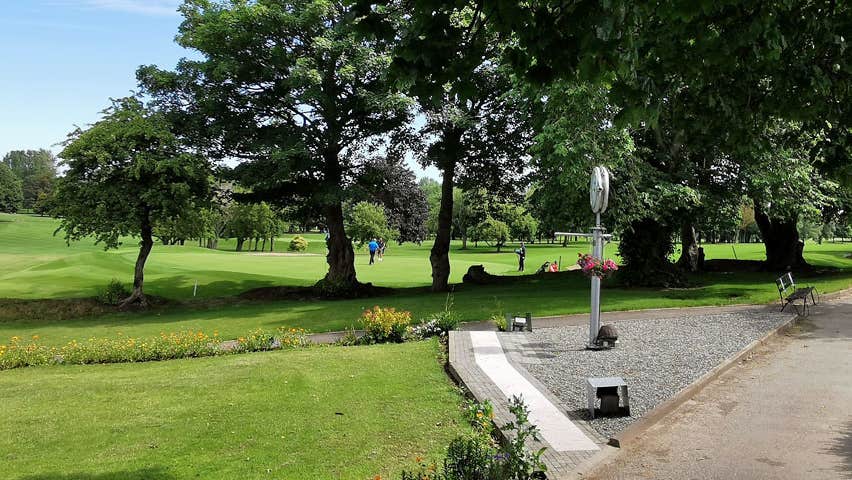 A view of the 18th green and the 1st tee box with fairways in the background