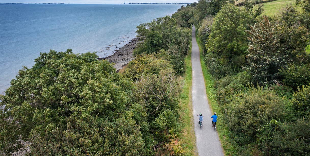 Two cyclists on the Carlingford Lough Greenway in County Louth.