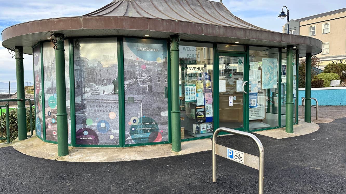 The exterior of Bundoran Community Tourist Office with a bicycle rail outside it