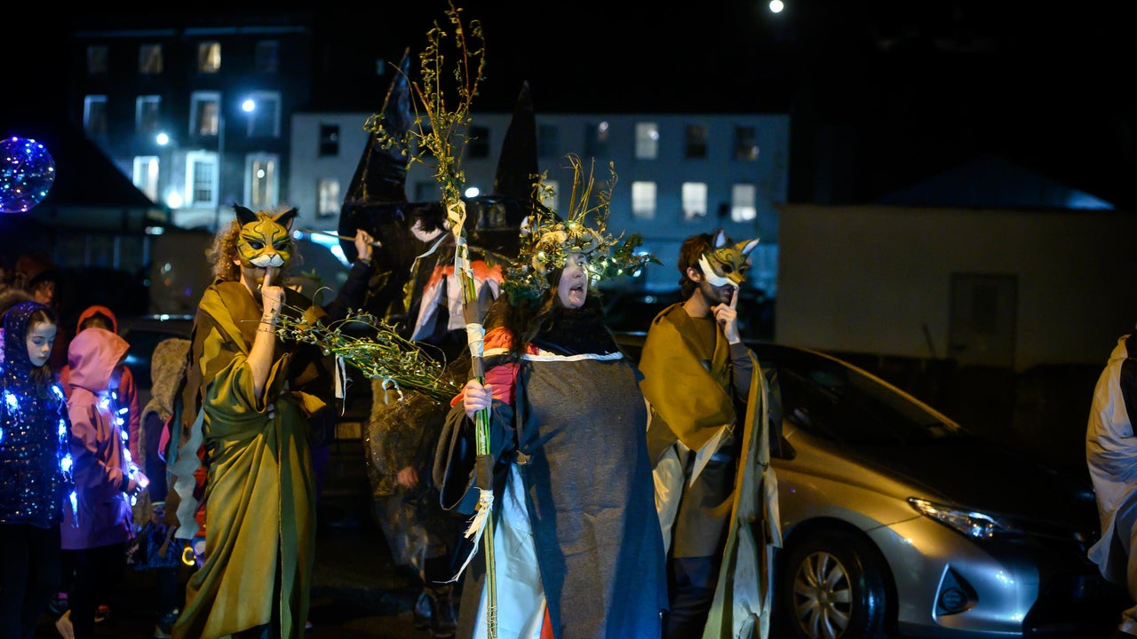 people and artists in parade