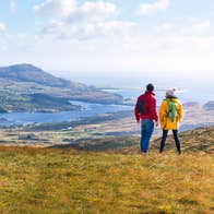 A couple out on a walk at Sliabh League (Slieve League) in Donegal, along the Wild Atlantic Way.