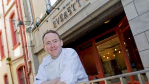 Chef standing outside the restaurant.