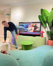 An illusion room at the museum with what appears as a man coming out of a television