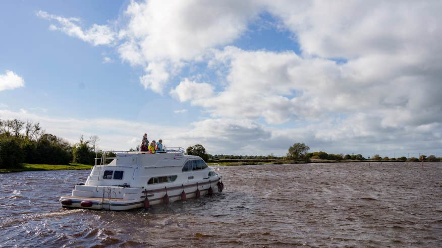 A family cruising the River Shannon in Banagher in Co Offaly