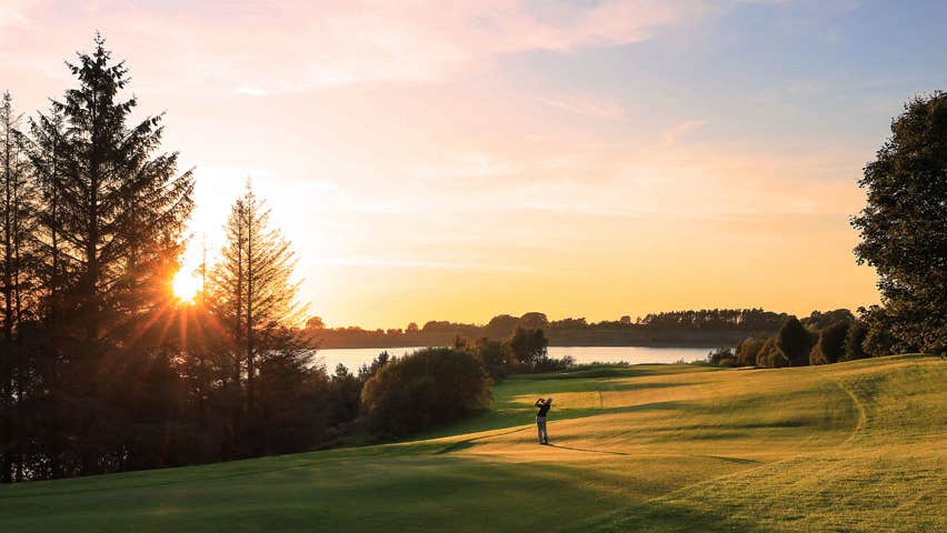 Golfer teeing off at Tulfarris Hotel Golf Club Blessington County Wicklow