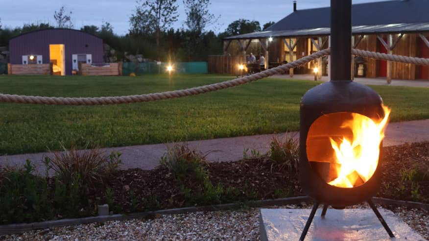 A chimenea with a fire burning in it.