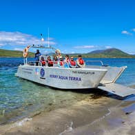 A boat called The Navigator moored on the shore