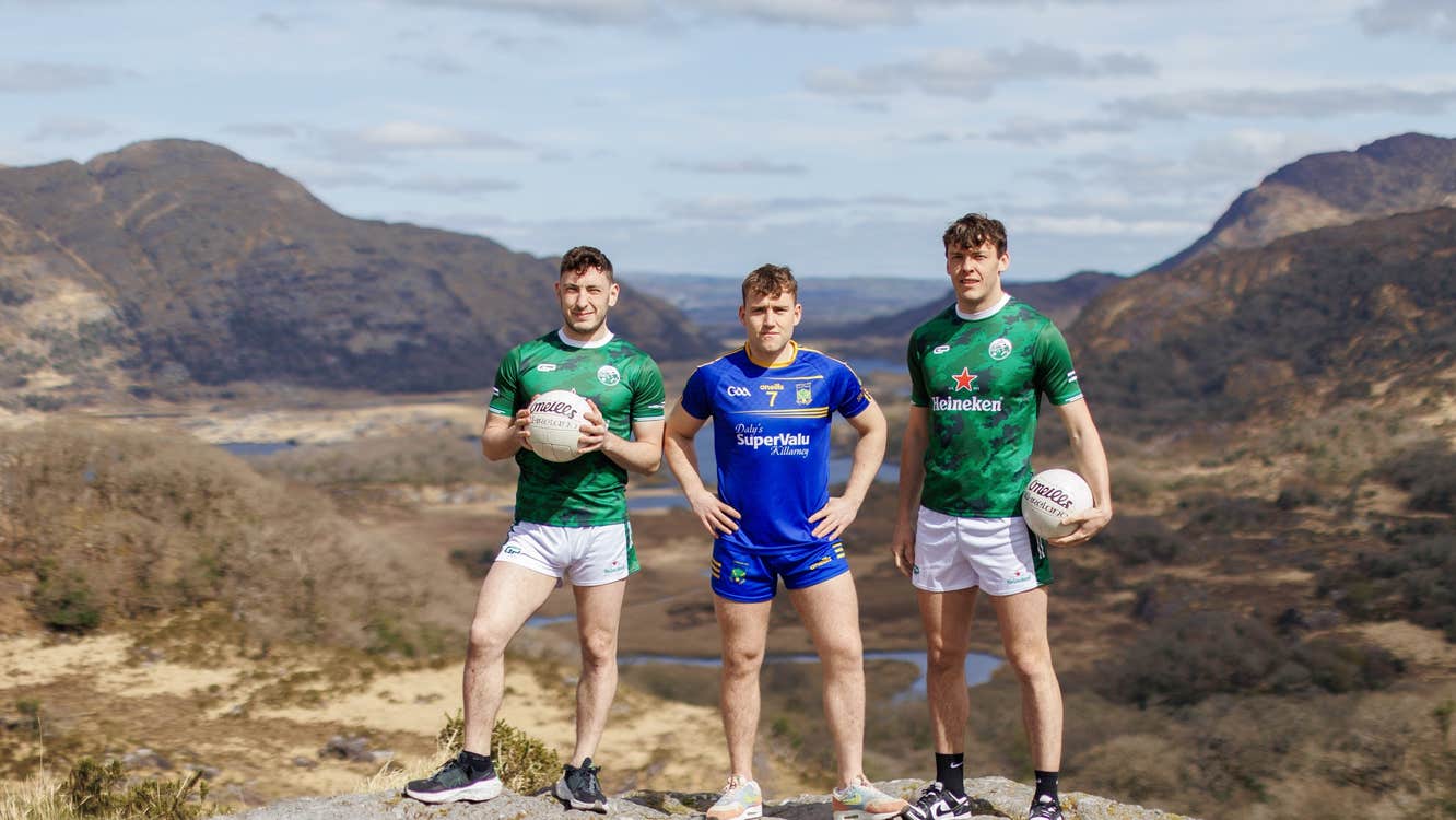 Paudie Clifford, Dara Moynihan, David Clifford - 3 men in club jerseys standing on a rock with rocky hills in the background.