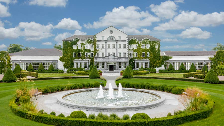 hotel exterior overlooking fountain and garden