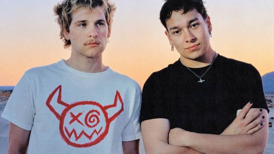 Joey Valence & Brae, 2 men in T-shirts with desert behind.