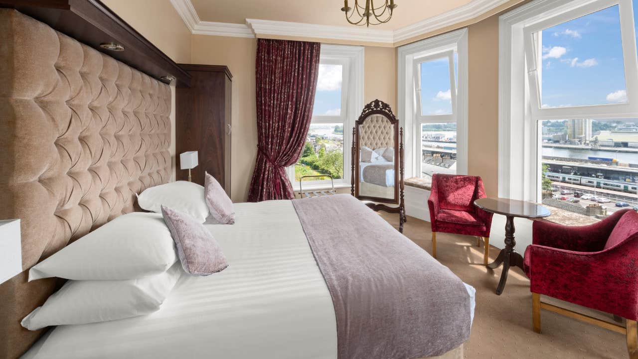 Double bed with white sheets