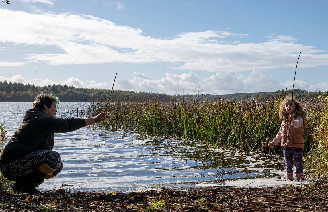 A woman and child by the water in Newtowngore in County Leitrim