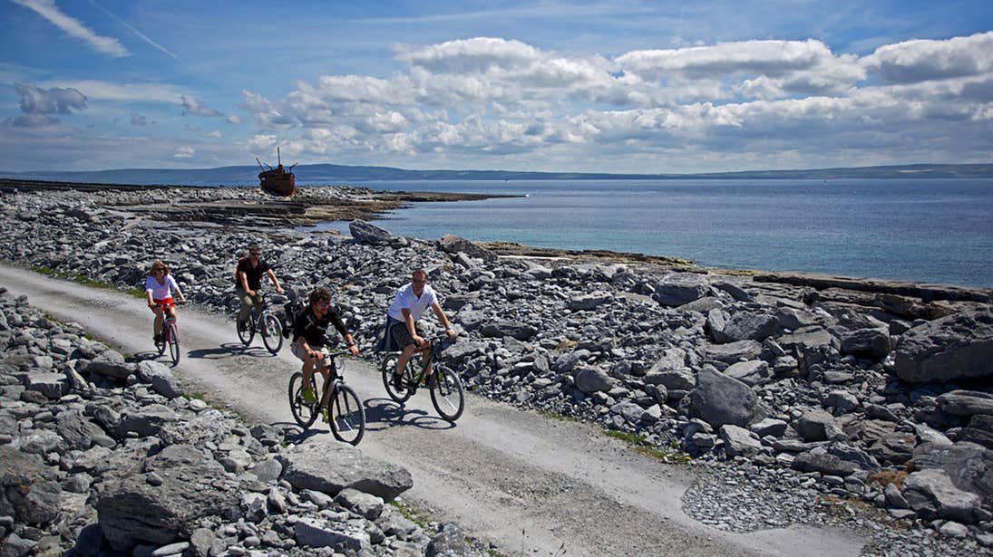 A group of friends cycling on Inisheer, Aran Islands, Galway
