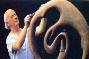 A sculptor working on a bogoak sculpture