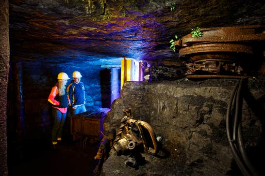 Two people wearing hard hats on a tour of Arigna Mining Experience in County Roscommon.