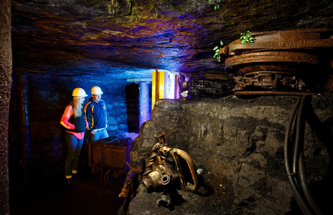 Two people wearing hard hats on a tour of Arigna Mining Experience in County Roscommon.