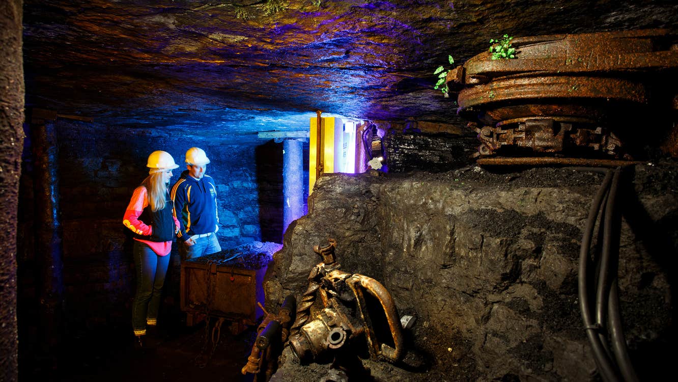 Two people wearing hard hats on a tour of Arigna Mining Experience in County Roscommon.
