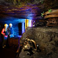 Two people wearing hard hats on a tour of Arigna Mining Experience in County Roscommon.