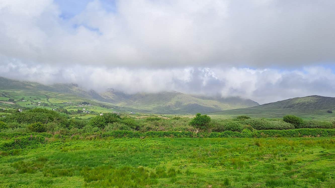 A view of green fields hills and skyline on the Beara Peninsula