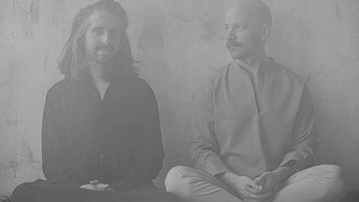 Metronome: Homebeat Present: Holden & Zimpel - grey photo of 2 men seated cross legged against a plain wall.