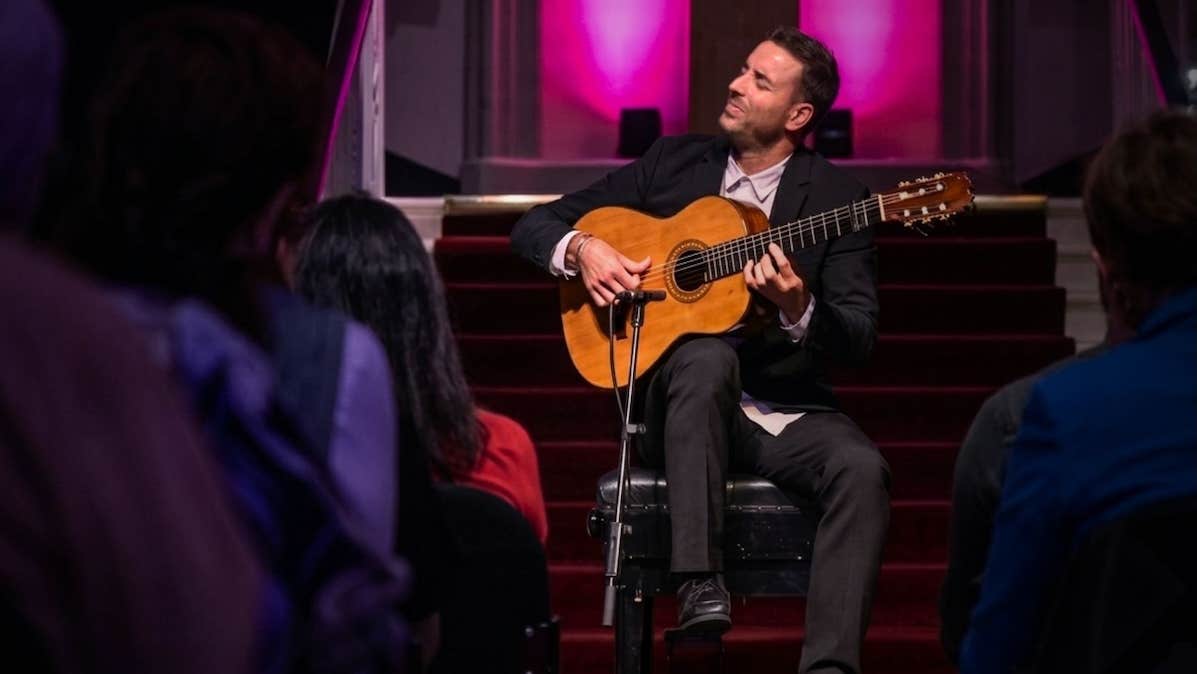 Juan José Manzano, Flamenco Guitar - a seated man playing a guitar with his eyes closed.